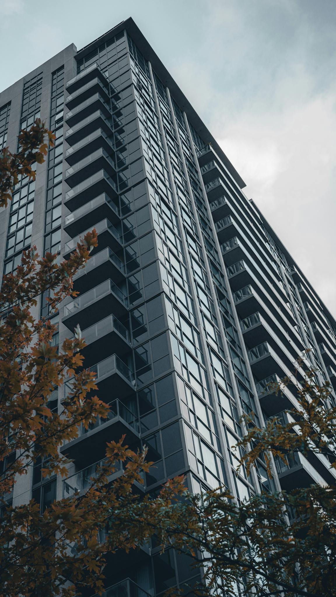 Dramatic view of a modern high-rise residential building in Mississauga, Ontario.